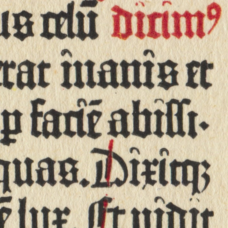 Optical alignment: the right edge of a column of the Gutenberg Bible, 1455, where a full stop and a hyphen are set outside the column so that the letters, not the punctuation, make the straight edge.